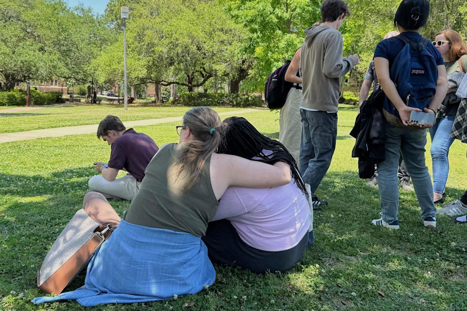 Students comfort each other on Florida State University’s campus.