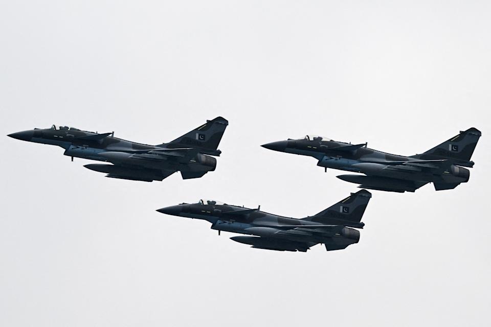 Three J-10C fighter jets in the sky.